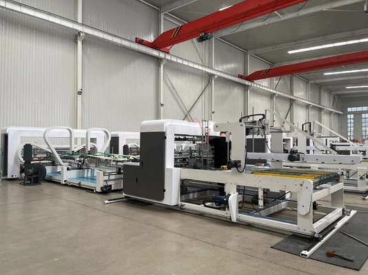 Machine automatique de couture de cartons ondulés